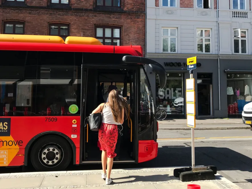 environmental transport girl and red bus