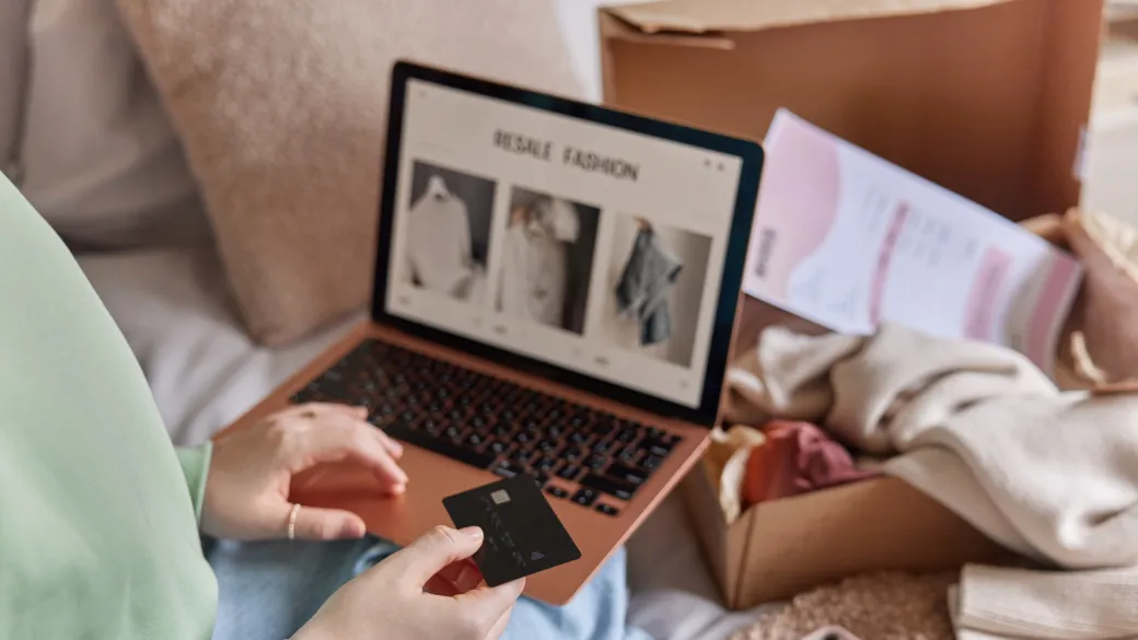 detail online payments person holds banking card uses laptop