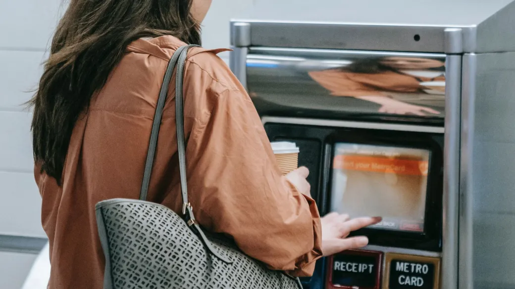 detail vending ticketing girl buys metro ticket