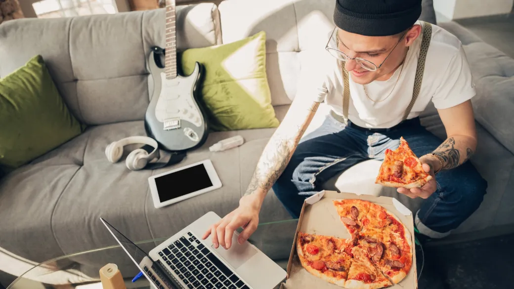 people online ordering eating pizza man studying home during online