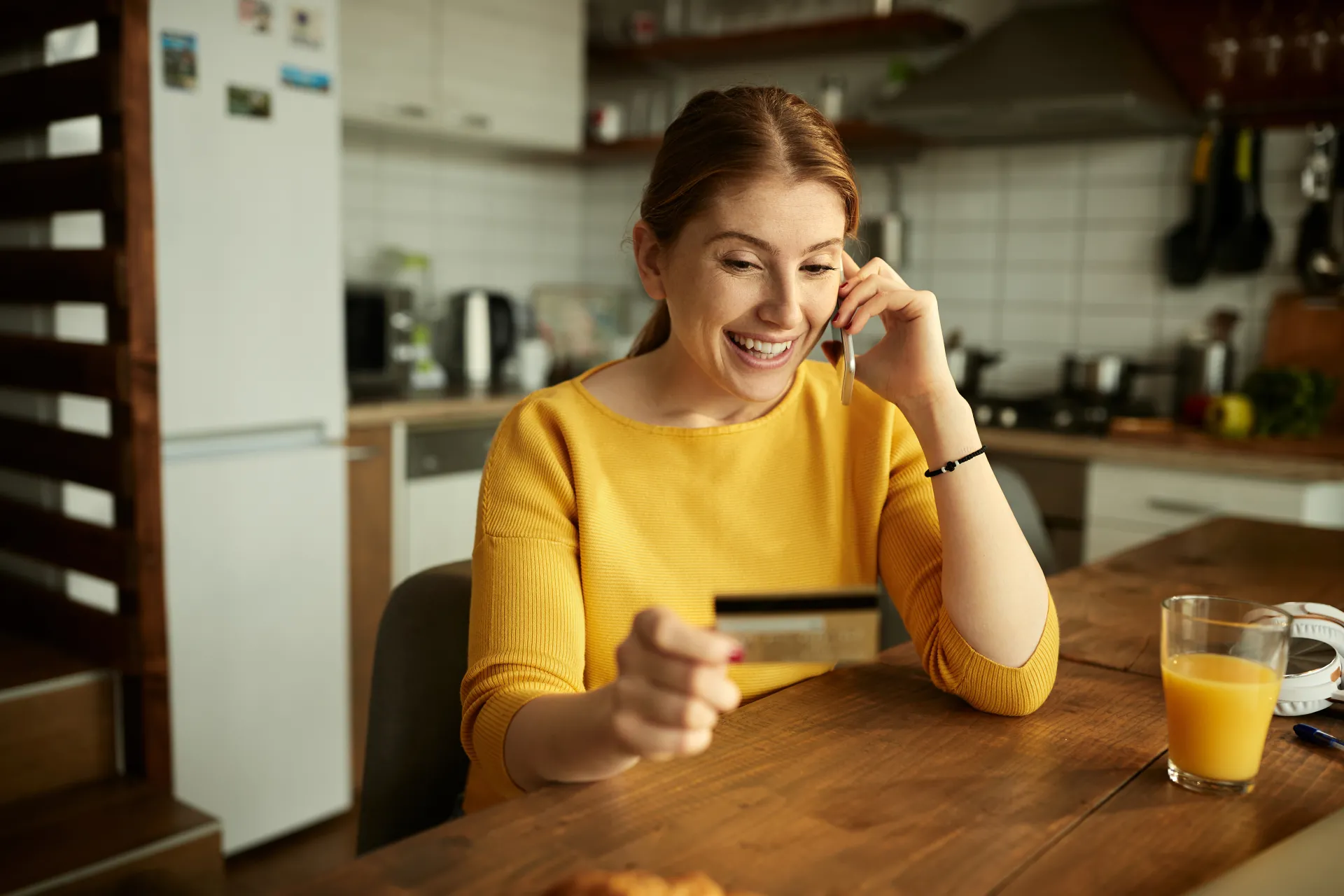 Woman giving card details over phone