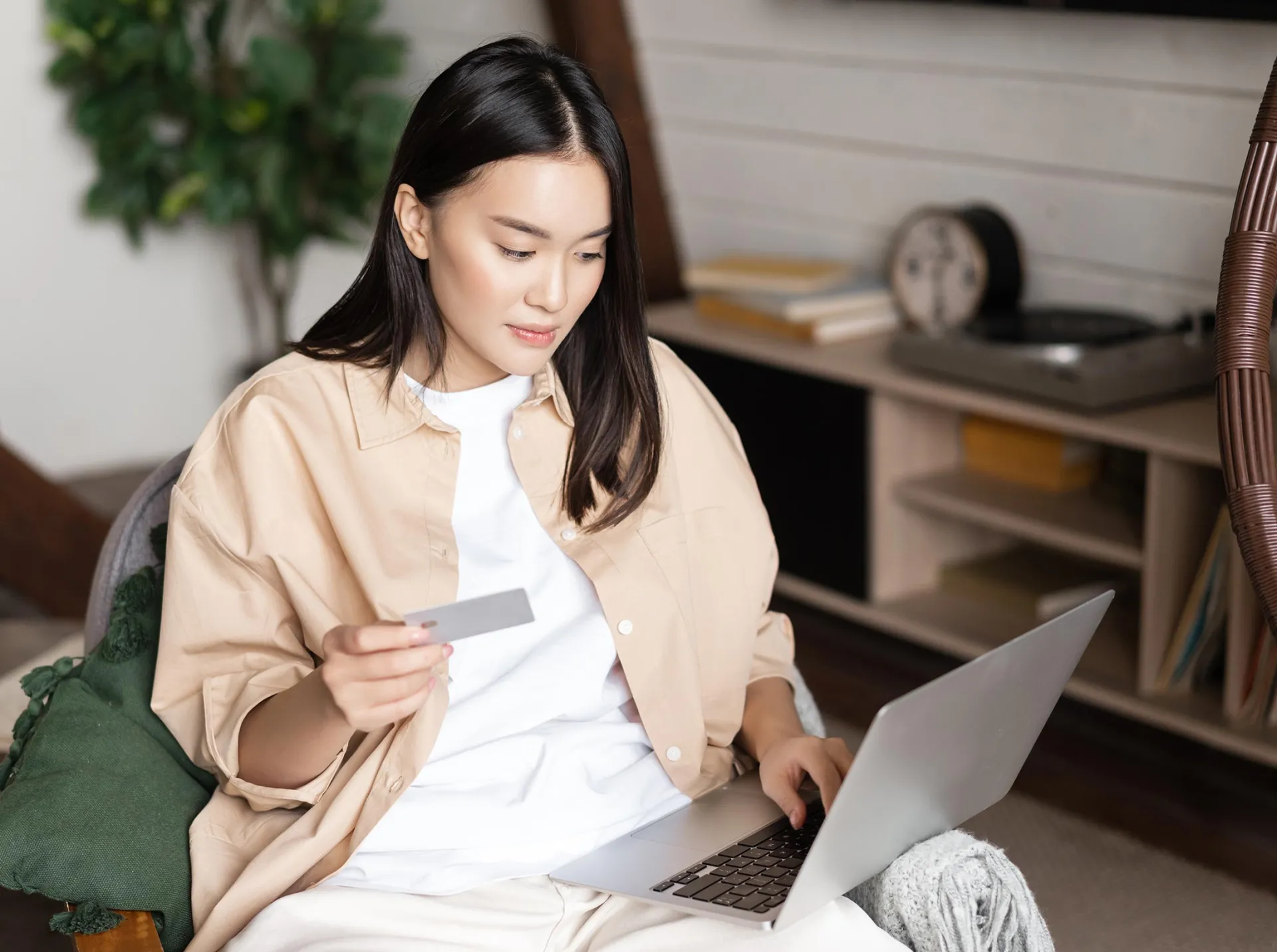 Asian Young woman doing online shopping on laptop