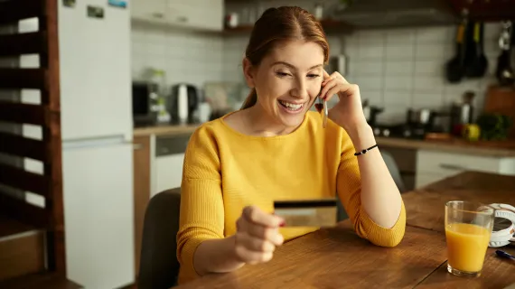 Woman giving card details over phone
