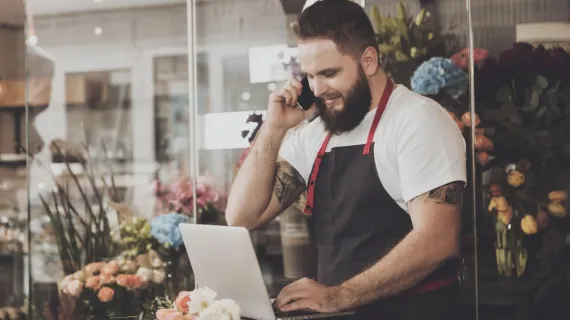 people cloud services bearded florist takes order mobile phone